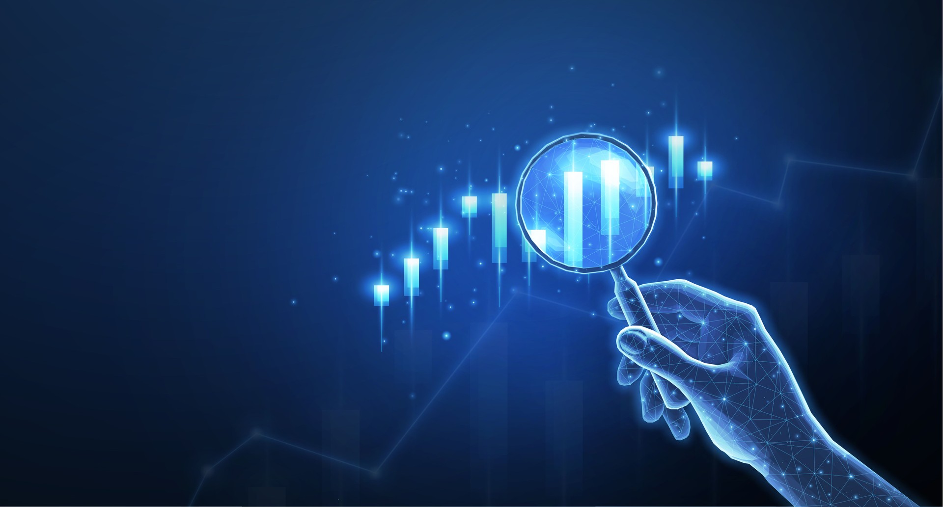 Hand with magnifying glass and stock chart
